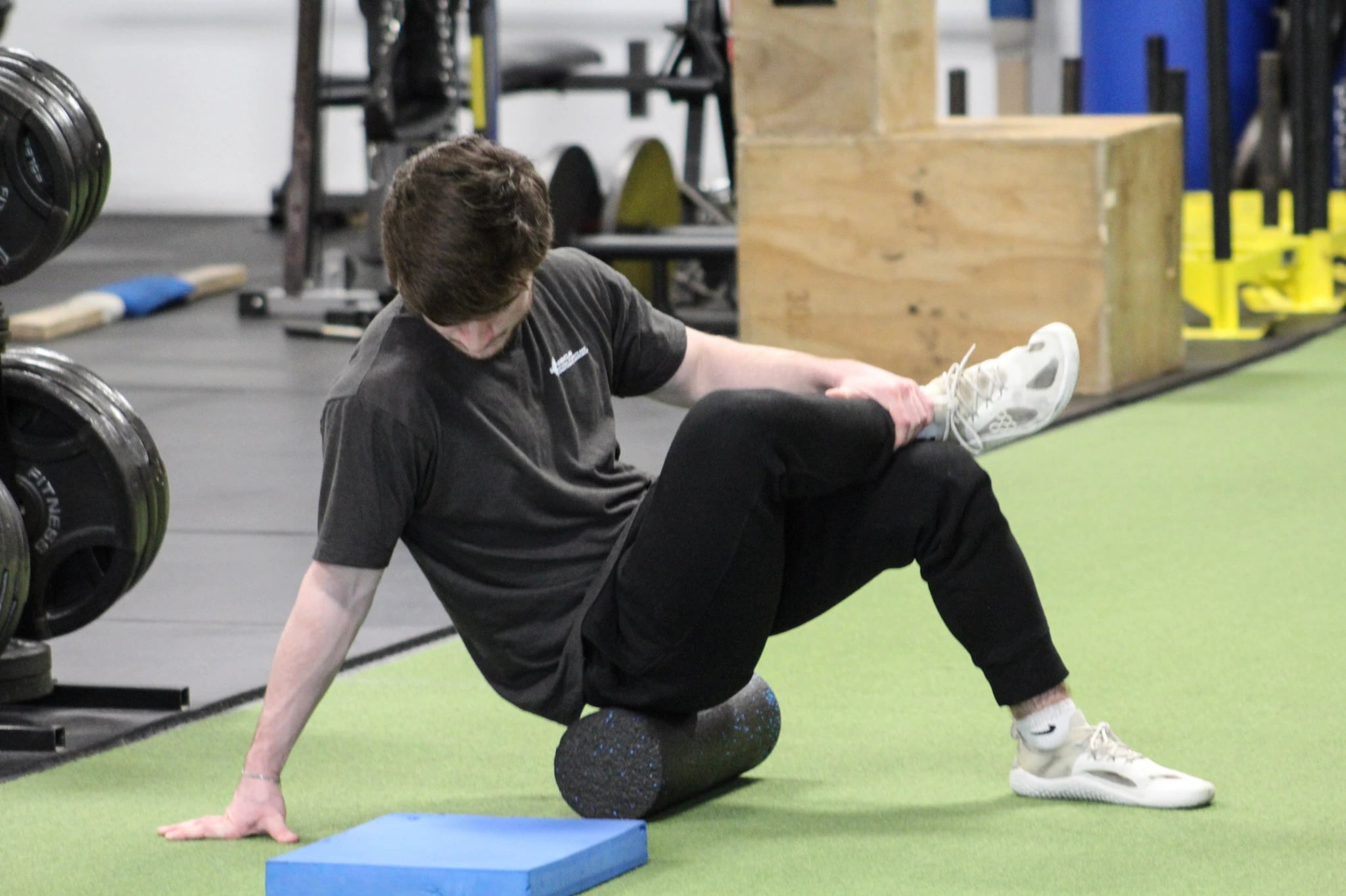 Nick demonstrating a mobility exercise in the gym